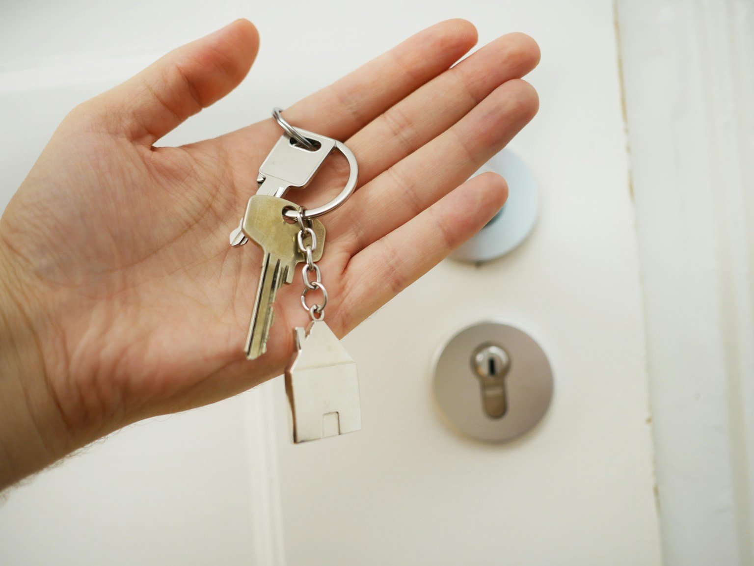 House keys being handed over on closing day at a Texas home purchase