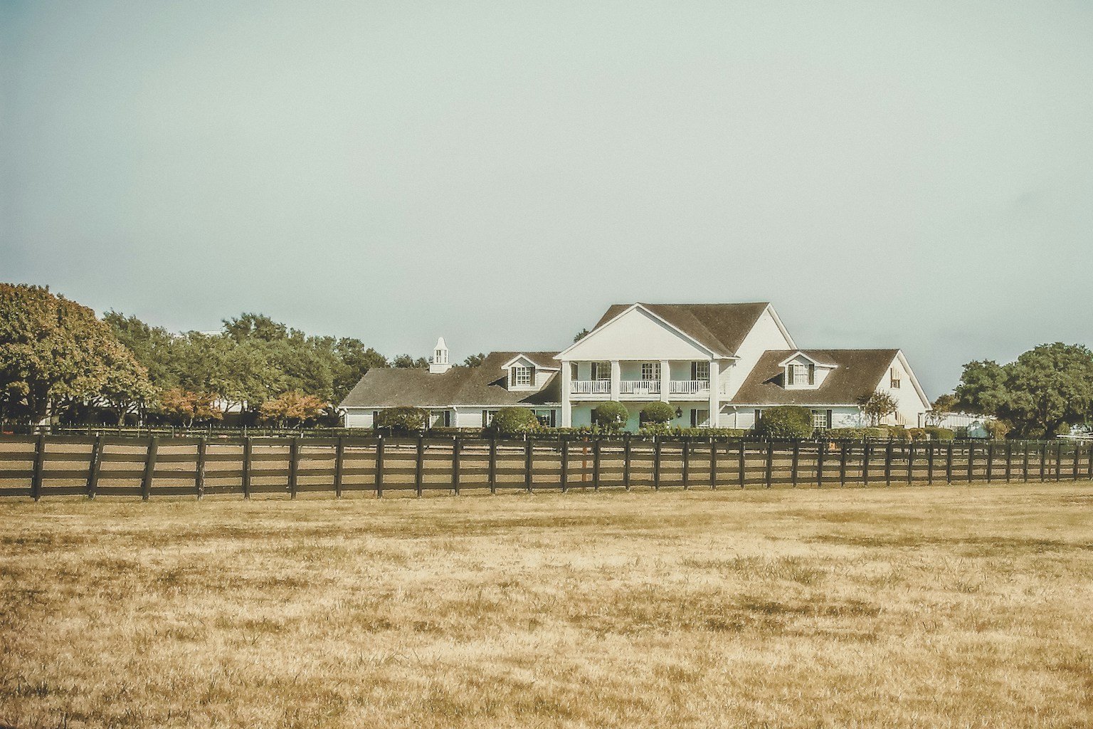 white two-story investment property house in Texas for DSCR loan guide