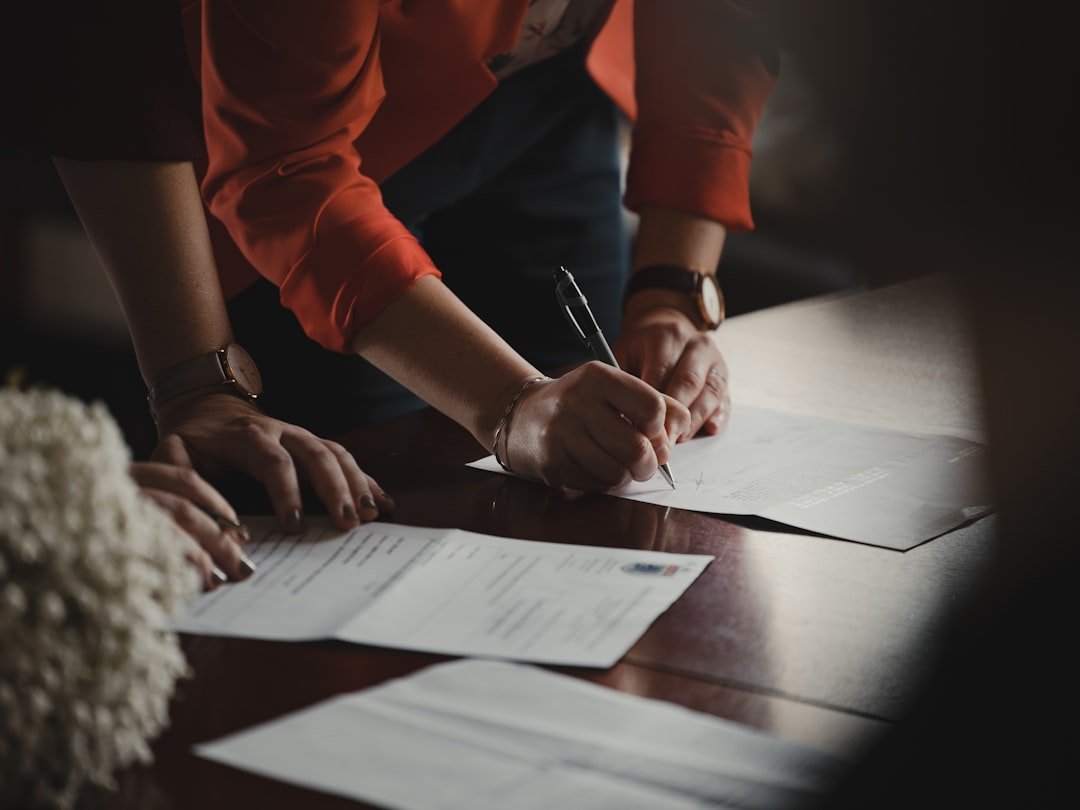 Person reviewing mortgage documents at desk