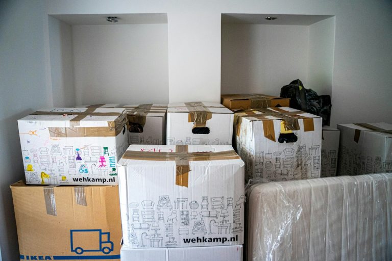 Moving boxes in a Texas home representing a move-up buyer selling and buying