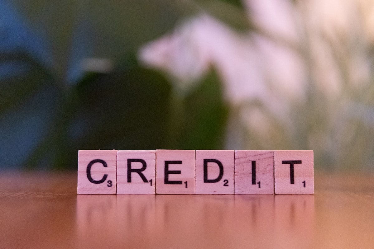 Wooden blocks spelling CREDIT representing credit score requirements for a Texas mortgage
