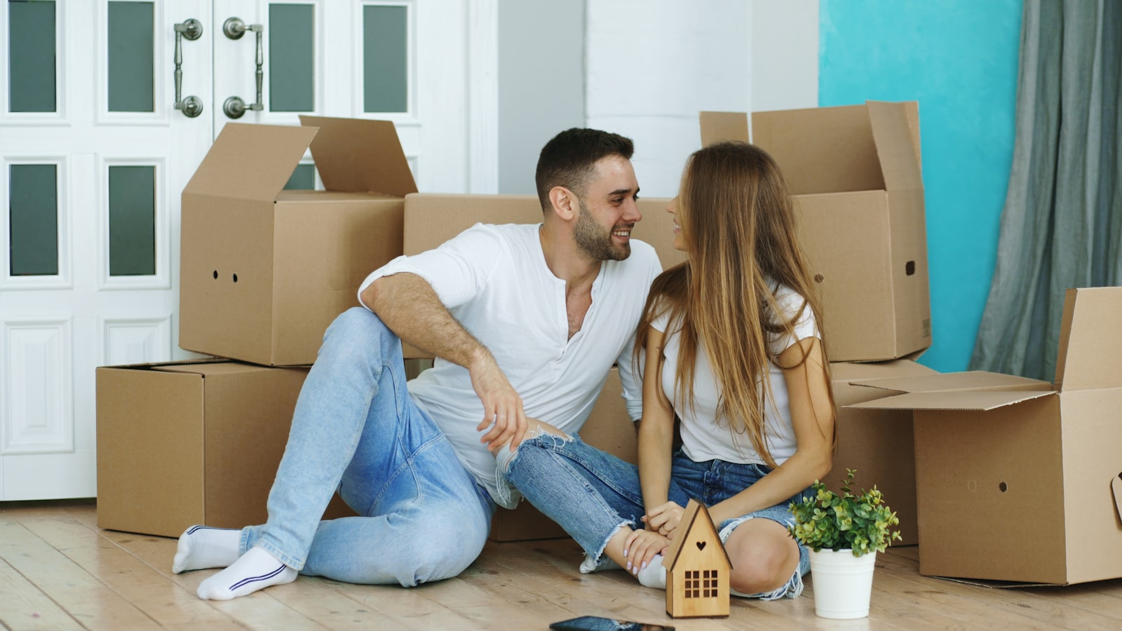 Couple moving into a new Texas home, illustrating buying with a non-occupant co-borrower