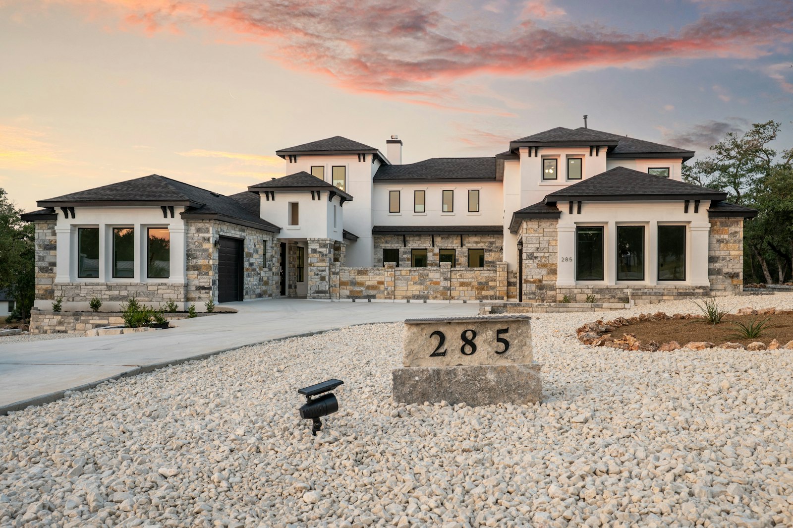 Modern Texas home at sunset, illustrating a mortgage recast that lowers the monthly payment