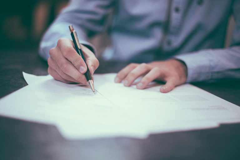 Texas homebuyer signing mortgage paperwork to lock an interest rate