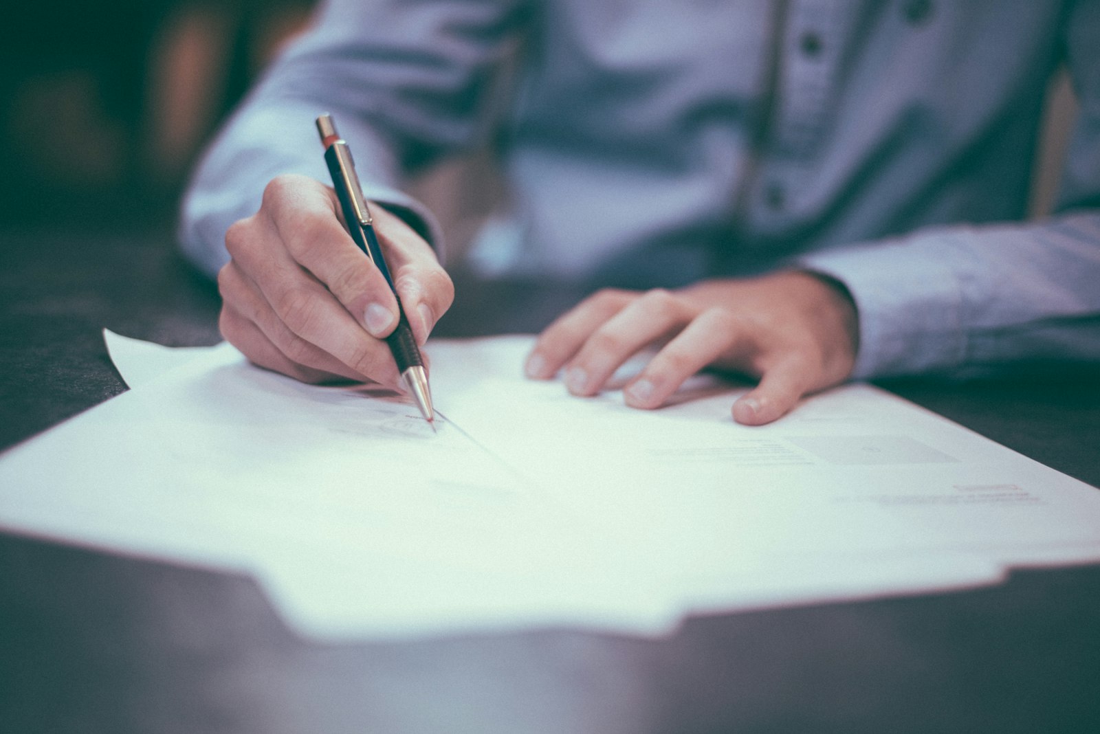 Texas homebuyer signing mortgage paperwork to lock an interest rate