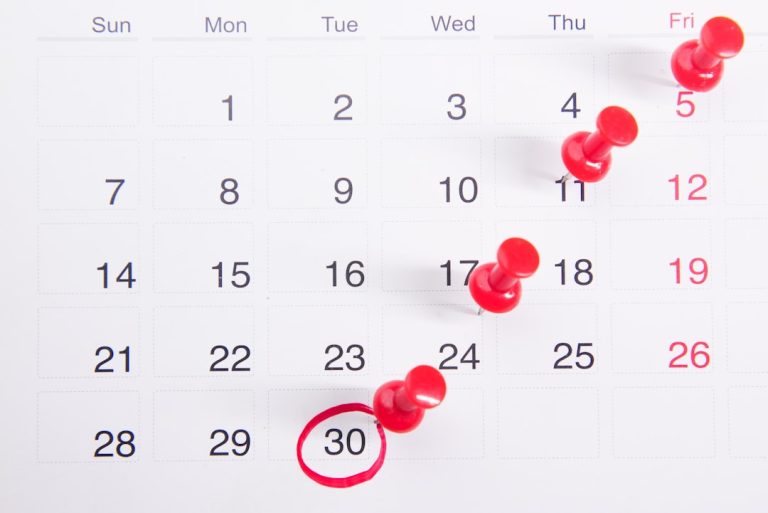 Wall calendar used to schedule biweekly mortgage payments on a Texas home loan